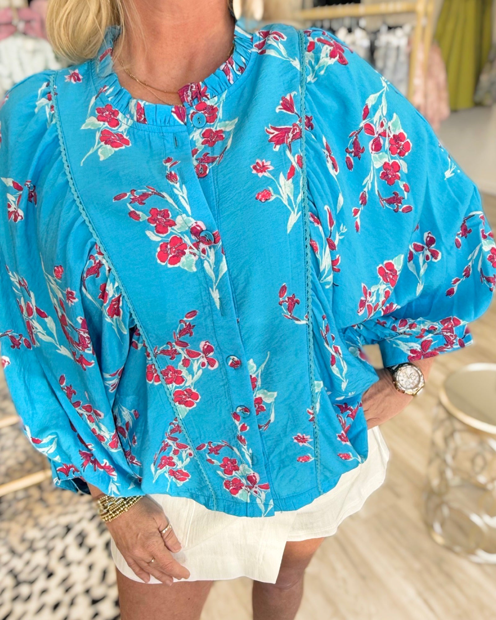 electric blue floral blouse boutique front view