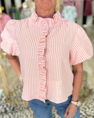 collared gingham blouse styled with white jeans